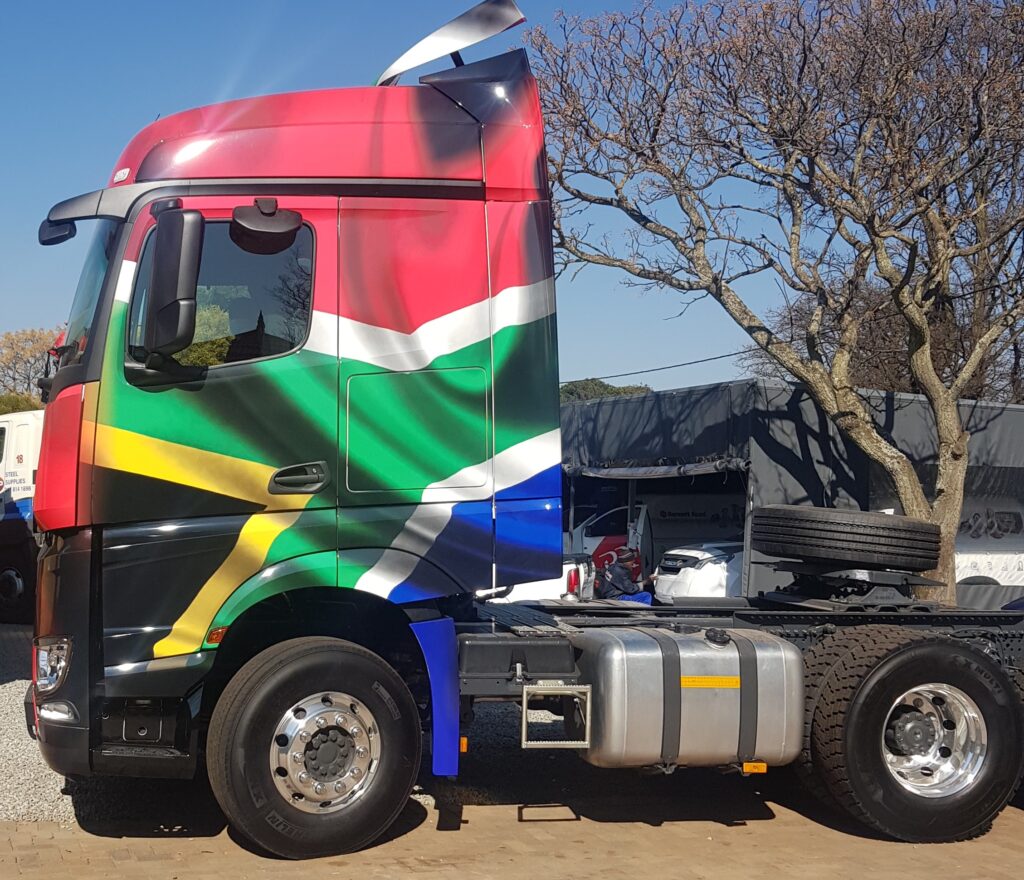 Mercedes Actros custom Sa Flag wrap on fleet  